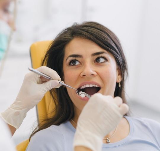 Dental patient receiving a dental exam