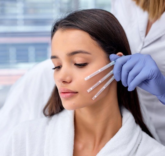 Dentist providing Botox injections to a patient