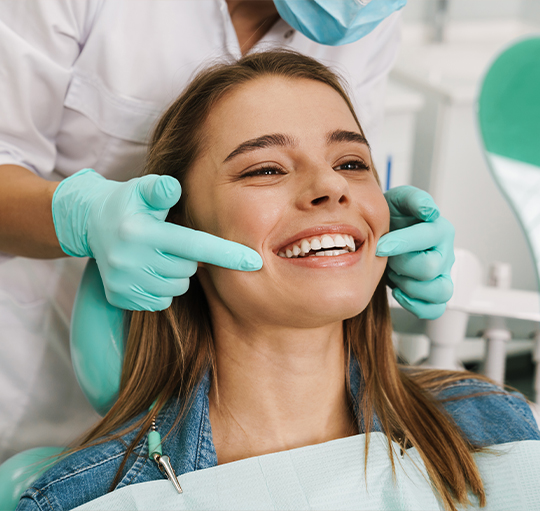 Young woman smiling before cosmetic dentistry treatment