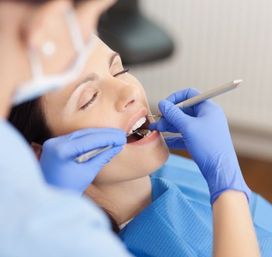 Honolulu emergency dentist giving a patient a dental exam