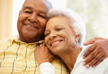 Senior man and woman hugging